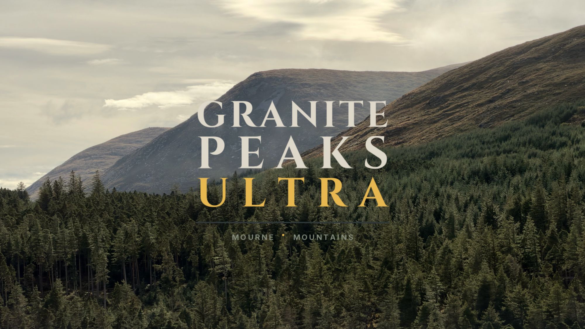 Granite Peaks Ultra, Mourne Mountains: the logo over grassy Mourne hillsides rising above a pine forest